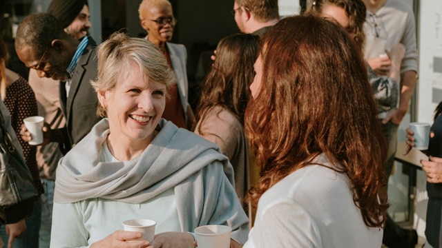 group of people chatting at a social event