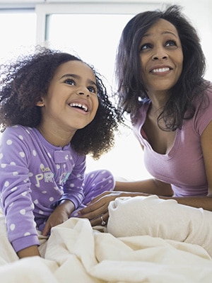 mother and child smiling