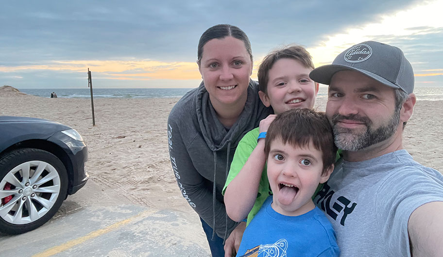 The Schneider family at the beach after their child received Bilateral Profound hearing loss diagnosis