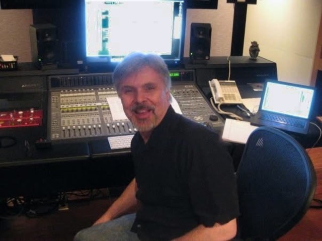 blog author Vince Werner sitting at an audio control desk