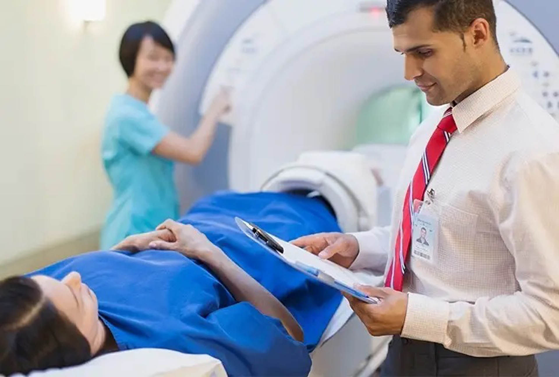 hearing healthcare provider talking to advanced bionics implant recipient who need an MRI