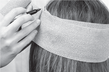 Remaining Coach bandage roll wrapped once around head