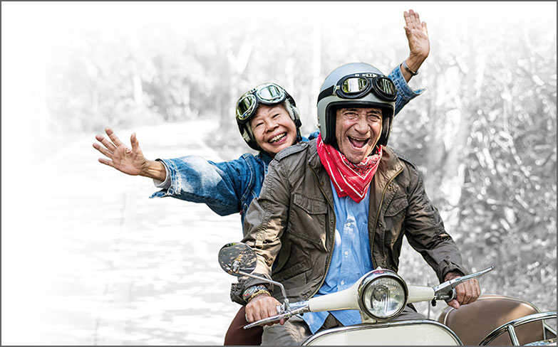 thumbnail mature couple riding a scooter