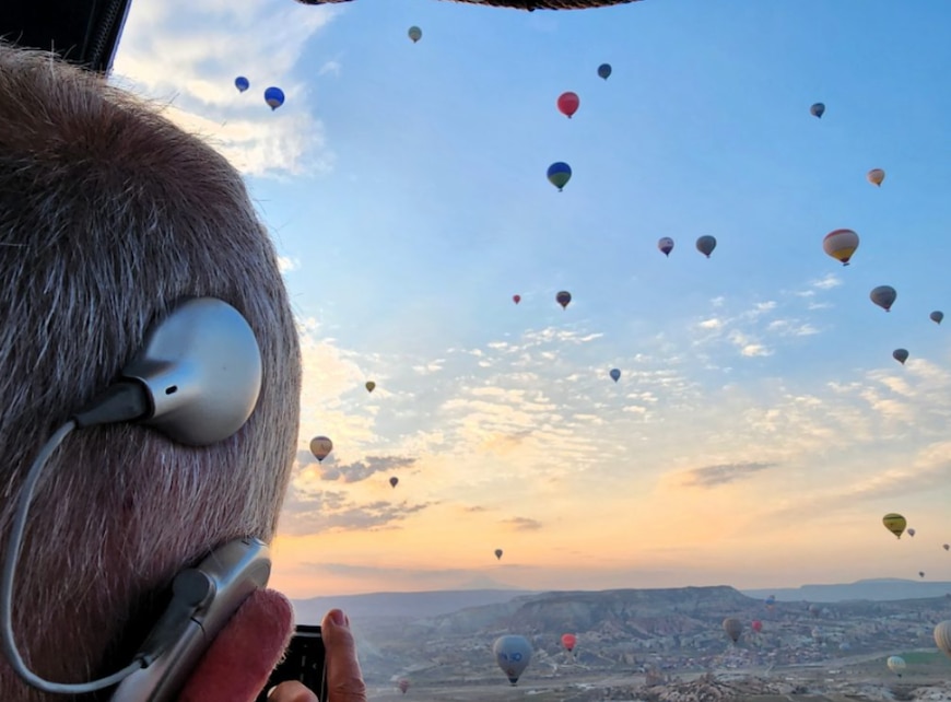 blog author Knud Erik looking out at a field of hot air balloons